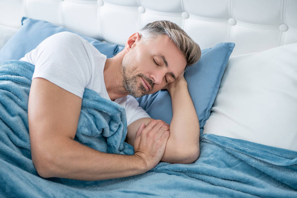 grizzle man sleeping in bed. early morning - Fotografie, Obrázek
