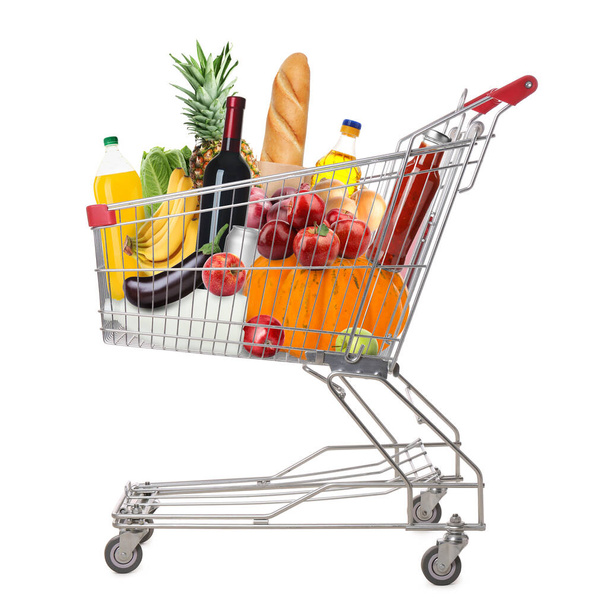 Shopping cart with groceries on white background - Fotoğraf, Görsel