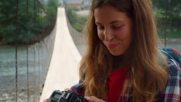 Smiling girl enjoy photographing beautiful nature . Woman check camera pictures. - Filmagem, Vídeo