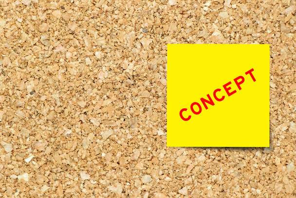 Yellow note paper with word concept on cork board background with copy space - Photo, image