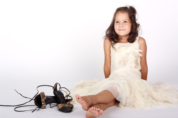 Little girl and mother's shoes - Fotó, kép