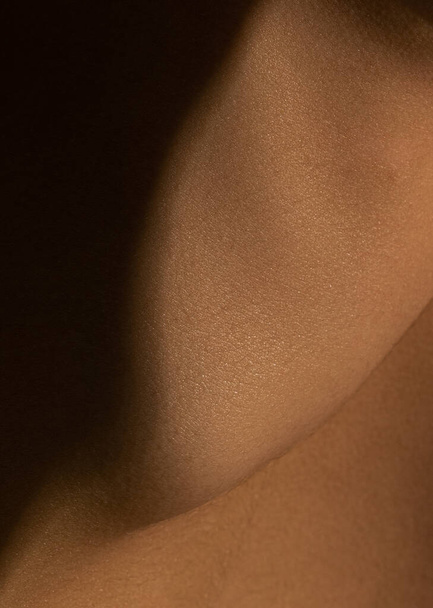 Close up part of womans body. Detailed texture of human skin. Beauty, art, skincare, bodycare, healthcare, hygiene and medicine concept. - Фото, зображення