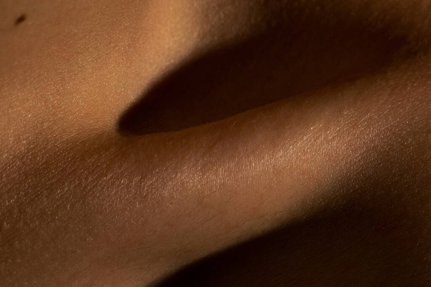 Close up part of womans body. Detailed texture of human skin. Beauty, art, skincare, bodycare, healthcare, hygiene and medicine concept. - Foto, Imagem