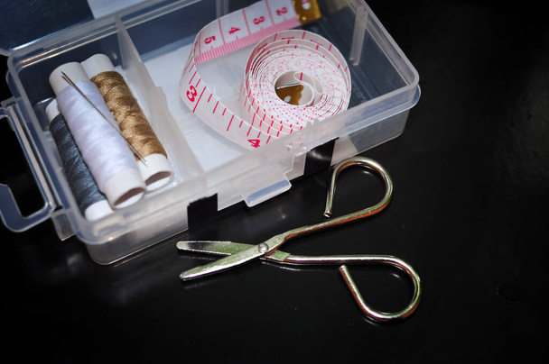 Equipment for sewing scissors tap measure and threads. - Valokuva, kuva