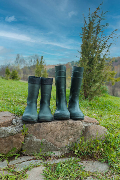 Rubber boots on green grass - Foto, immagini