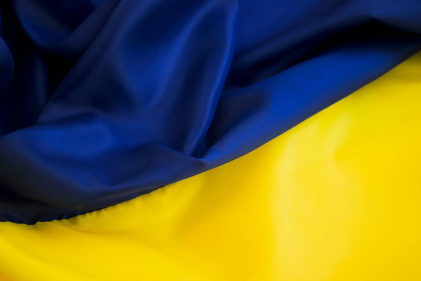 National flag of Ukraine close up silk background - Φωτογραφία, εικόνα