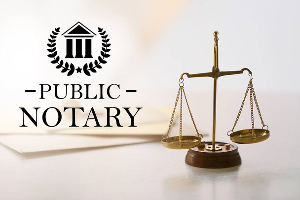 Scales of justice and text PUBLIC NOTARY on light background - Photo, image