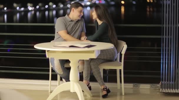 A romantic couple having fun in a cafe, in love with Valentines Day - Video