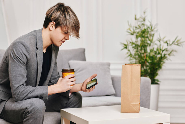 man sit on the couch and shopping in internet stores - Photo, Image