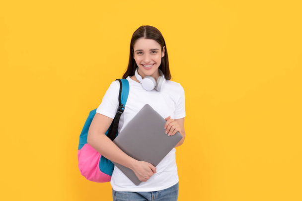 back to school. influencer blogging. glad girl with backpack and headphones. - Фото, изображение