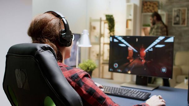 Red headed woman upset she lost while playing shooter games - Photo, Image