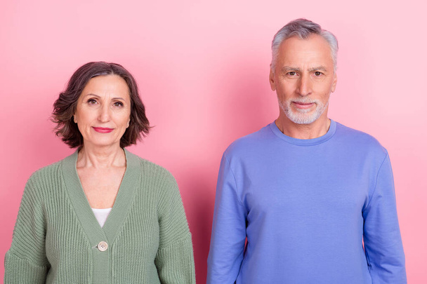 Portrait of two handsome beautiful content people team standing together isolated over pink pastel color background - Fotografie, Obrázek