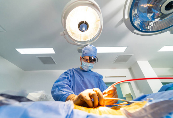 Professional surgeon in mask operating. Doctor surgery specialist in uniform. - Photo, Image