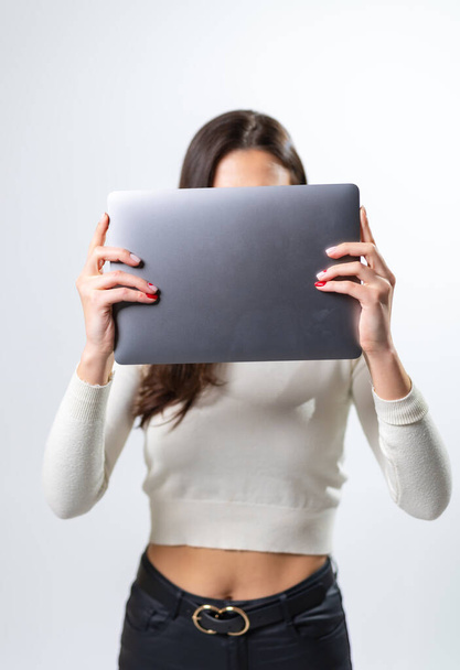Modern technology computer devices. Grey laptop in woman hands. - Foto, afbeelding