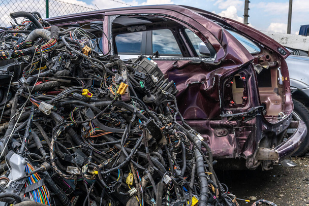dismantling of a car into spare parts at a junkyard - Фото, изображение