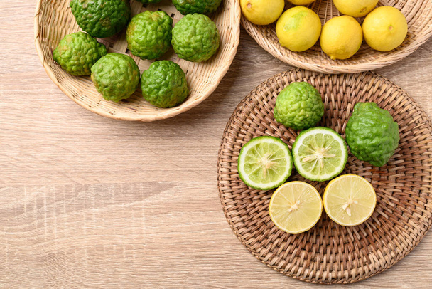 Kaffir lime and yellow lime, Asian citrus fruit  - Foto, afbeelding