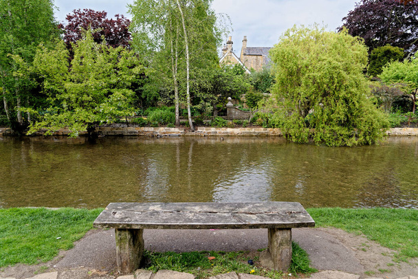 View across the river Windrush - Summer afternoon in the Cotswold village of Bourton on the Water, Gloucestershire, England, United Kingdom. 25th of May 2015 - Foto, Bild