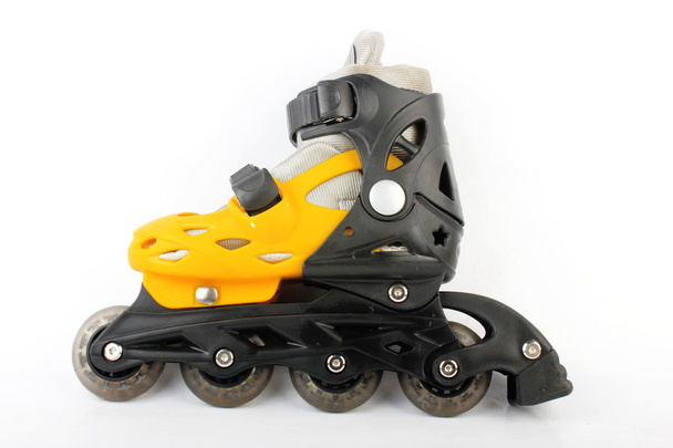 Yellow & Black Colored roller skates isolated on white - Foto, afbeelding