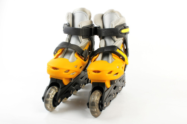 Yellow & Black Colored roller skates isolated on white - Photo, image
