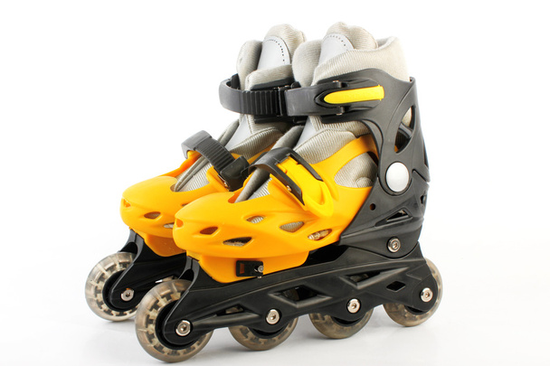 Yellow & Black Colored roller skates isolated on white - Foto, Bild