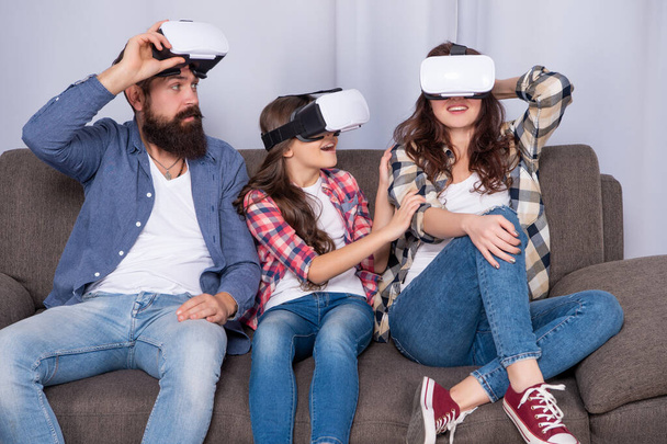 father mother and child wireless glasses. virtual reality family. - Foto, afbeelding