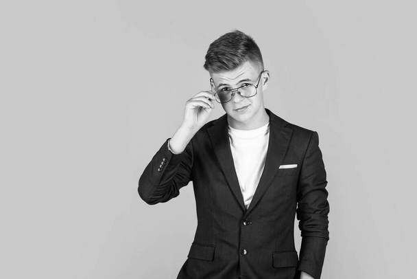 successful businessman. trendy looking teenager. child in black jacket. confident kid boy wear glasses. - Fotografie, Obrázek
