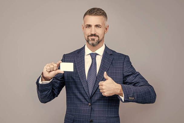 this is success. businessman demonstrating credit card. empty plastic business name card. - Photo, image