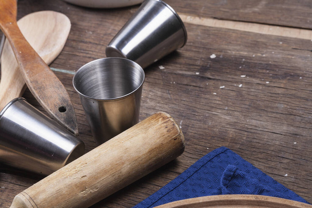 Old vintage kitchen tools on brown wooden background - Fotografie, Obrázek