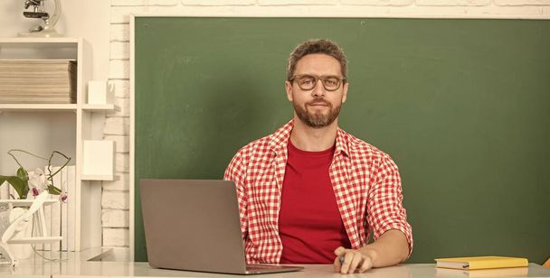nerd student study online. private teacher in classroom with blackboard at pc. - Photo, Image
