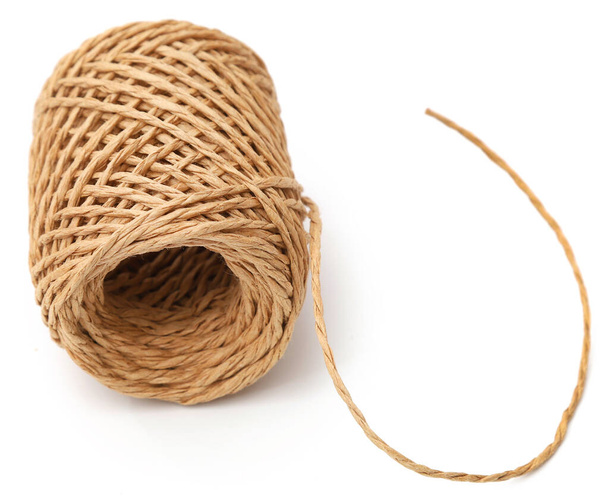 Thread ball made of natural jute fiber over white background - Photo, Image