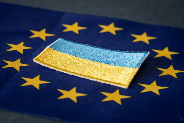 The concept of Ukraine joining the European Union, the Ukrainian flag lying in the middle of the EU stars - Fotó, kép
