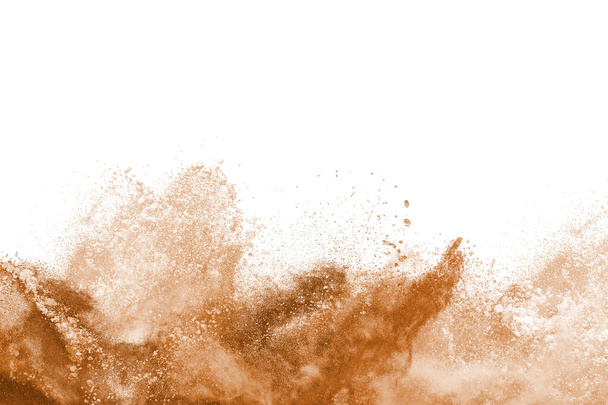 Brown powder explosion isolated on white background. - Photo, Image