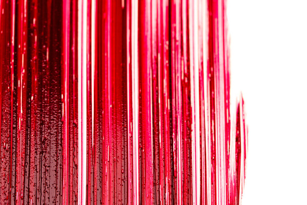 lipstick background.Makeup and cosmetics product . Red lipstick swatch macro.Lipstick texture on a white background. red lipstick surface. - 写真・画像