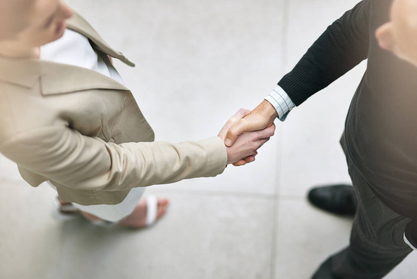 Your handshake is an extension of your personality. Cropped shot of two businesspeople shaking hands. - 写真・画像