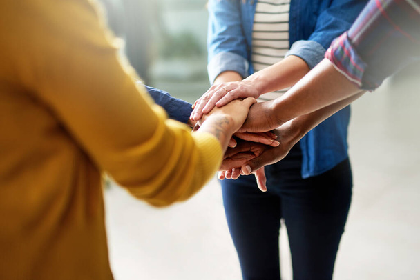 Team motivation will drive them to success. Closeup shot of a group of businesspeople joining their hands together in unity. - Fotografie, Obrázek