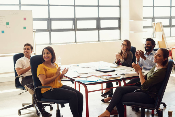 Glorify the success. Shot of creative employees having a meeting in a modern office. - Foto, Bild