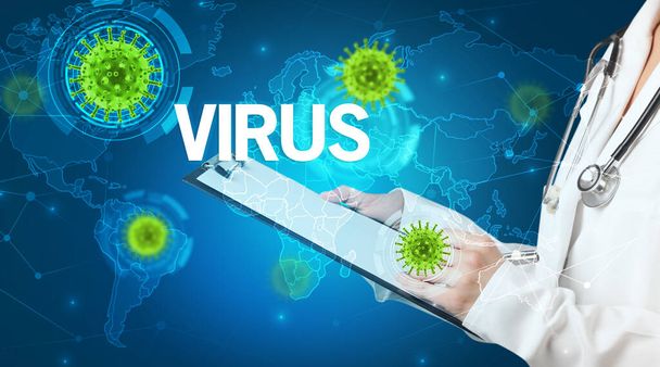 Doctor fills out medical record with VIRUS inscription, virology concept - Photo, image