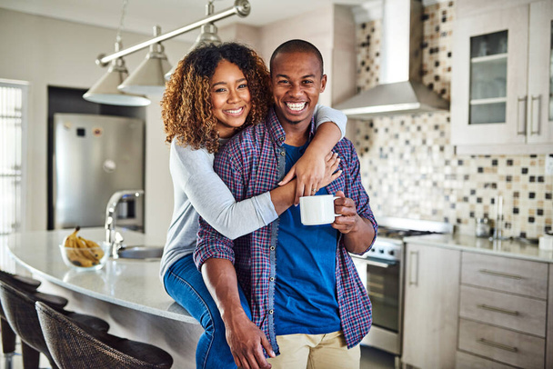 The perfect way to start the weekend. Cropped portrait of an affectionate young couple in their kitchen at home. - Fotoğraf, Görsel