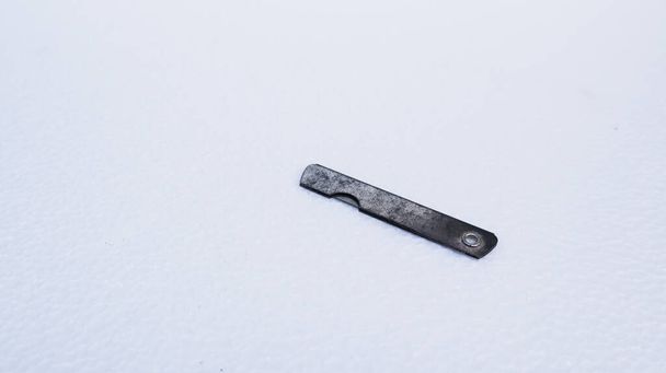 rusty razor blade on a white background - Фото, изображение