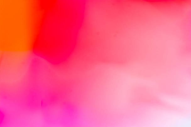Multicolored bright background in orange, red, pink, tones. Abstraction with a smooth gradient. Backdrop - Foto, Bild