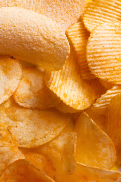 bunch of different delicious and salty potato chips, top view  - 写真・画像