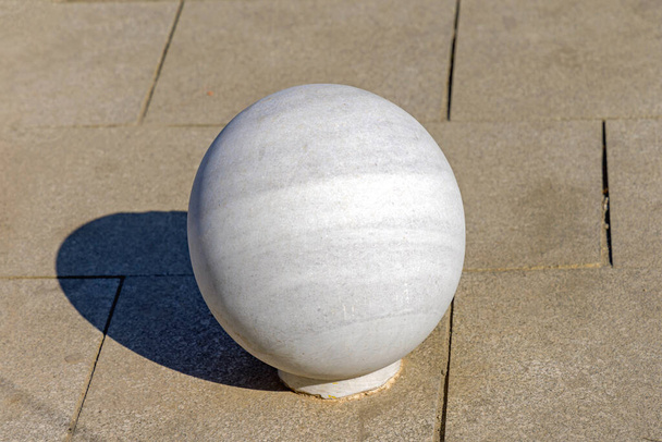 Very Large White Marble Ball at Street Pavement - Foto, imagen