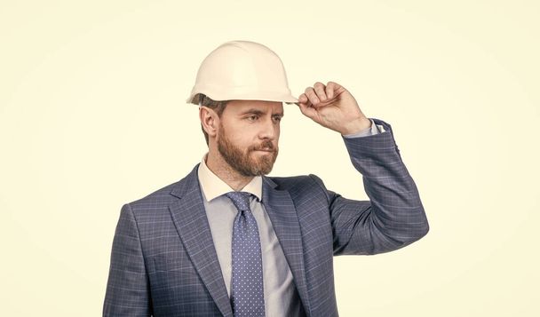 safety business. successful man with greeting gesture. entrepreneur in protective helmet. - Foto, imagen