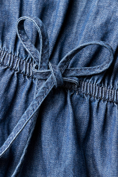 Jeans cloth, denim blue weathered material, trendy fashion textile - Фото, изображение