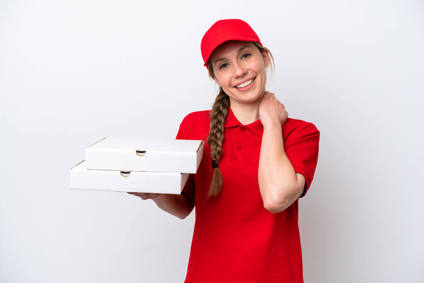 pizza delivery woman with work uniform picking up pizza boxes isolated on white background laughing - Zdjęcie, obraz