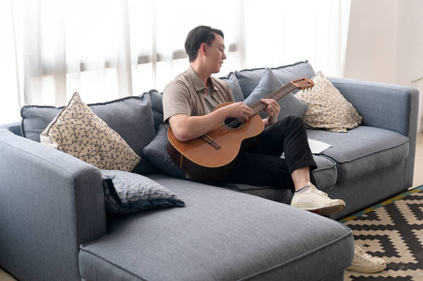 A musician is writing song in home Studio  - Φωτογραφία, εικόνα