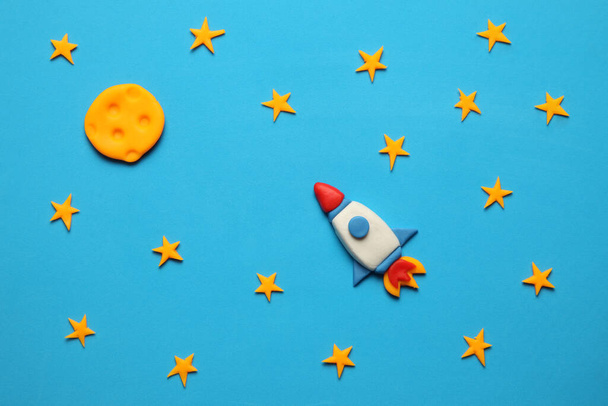 Rocket in space, star, and moon. Plasticine art, cartoon. - Photo, image