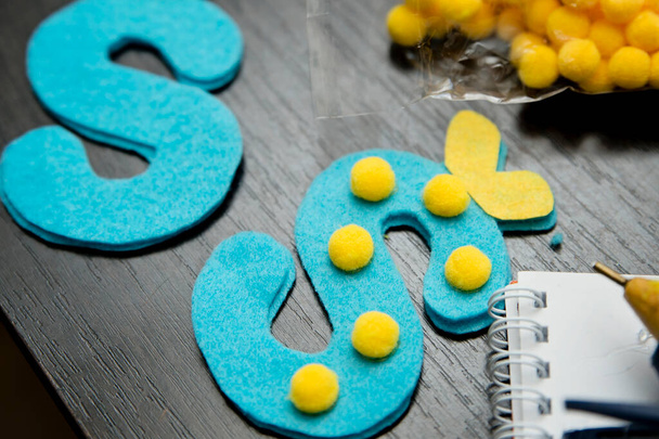 Hand made felt alphabet letters with decorations. DIY ideas for creative and inventive mothers. - Fotó, kép