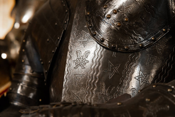 Antique armour on black background. Concept for security, safety and fantasy - Zdjęcie, obraz