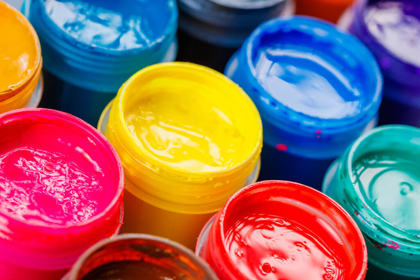 full-frame close-up background of opened small gouache paint jars - Fotografie, Obrázek